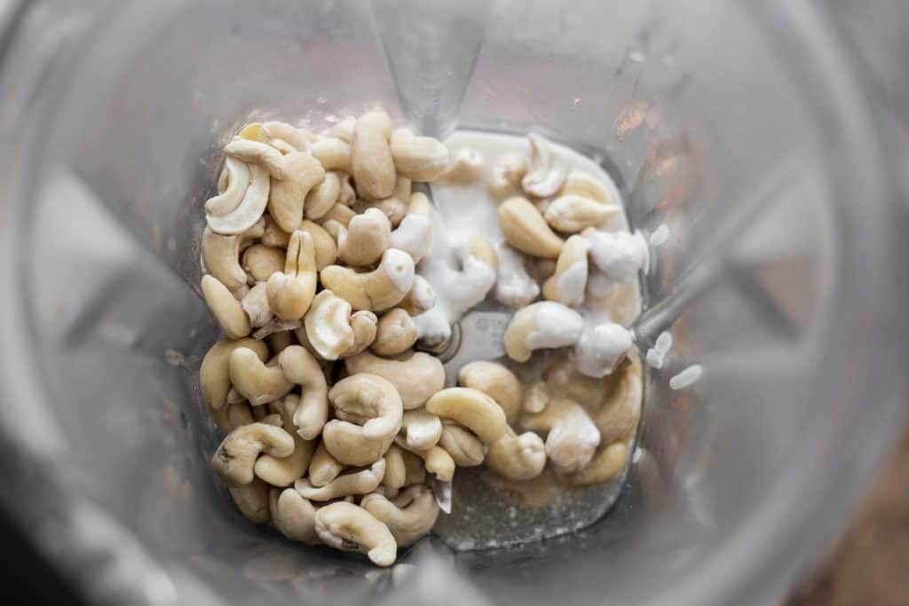 ingredients for cashew cream in a blender