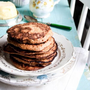 Stack of Flourless Banana Walnut Pancakes on a plate.