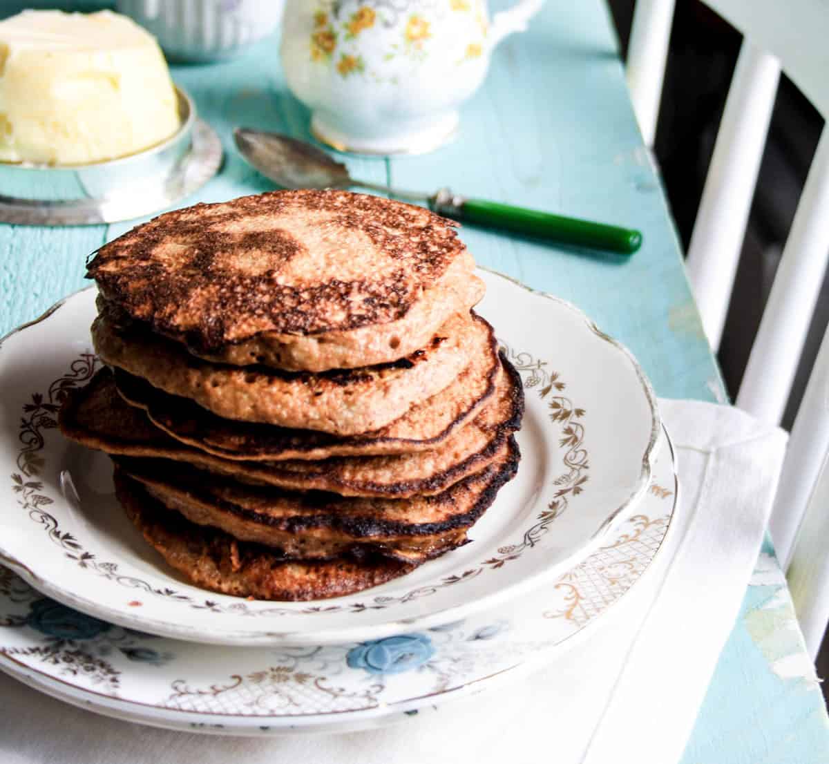 Stack of Flourless Banana Walnut Pancakes on a plate.