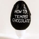 An Easter Egg with How To Temper Chocolate written on the side
