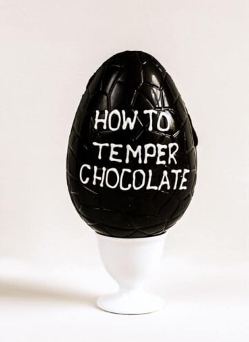 An Easter Egg with How To Temper Chocolate written on the side