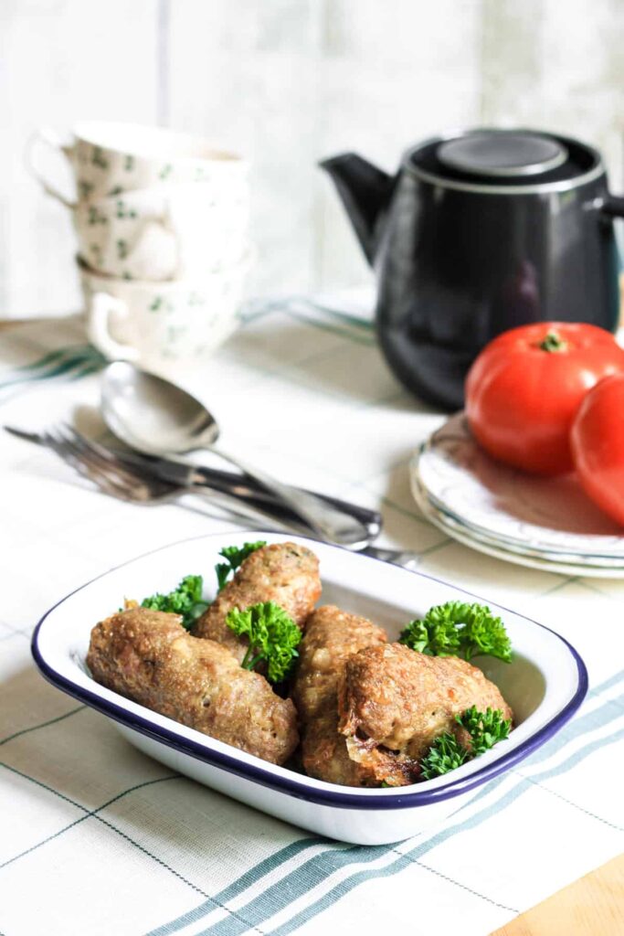 An oven proof dish filled with Chicken Thyme and Fennel Sausages