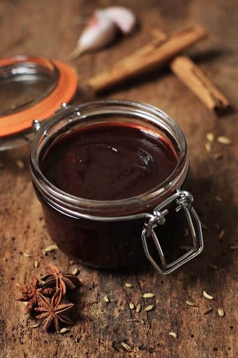 A close up of a jar of chinese damson sauce