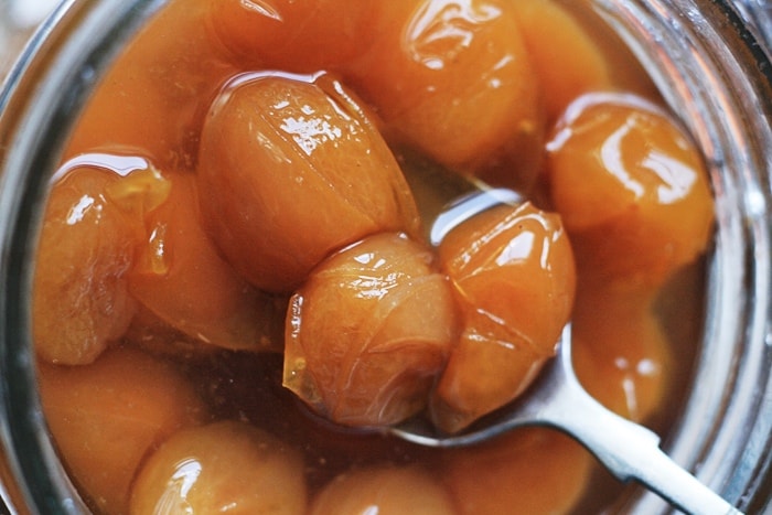 close up of pickled mirabelles