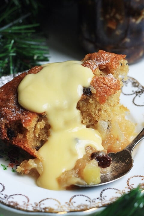 Close-up of Bramley Apple and Mincemeat Pudding drizzled in custard