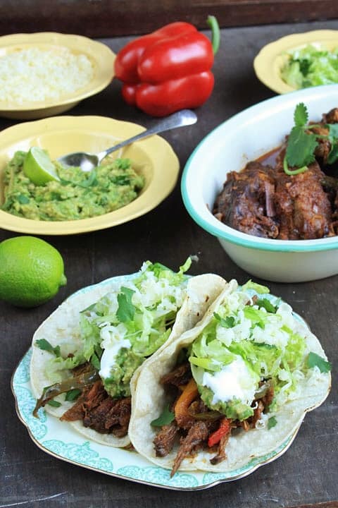A plate of Chipotle Braised Brisket Tacos on a table