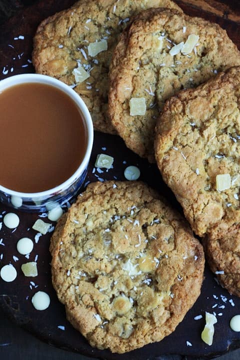 plate of cookies next to cup of tea
