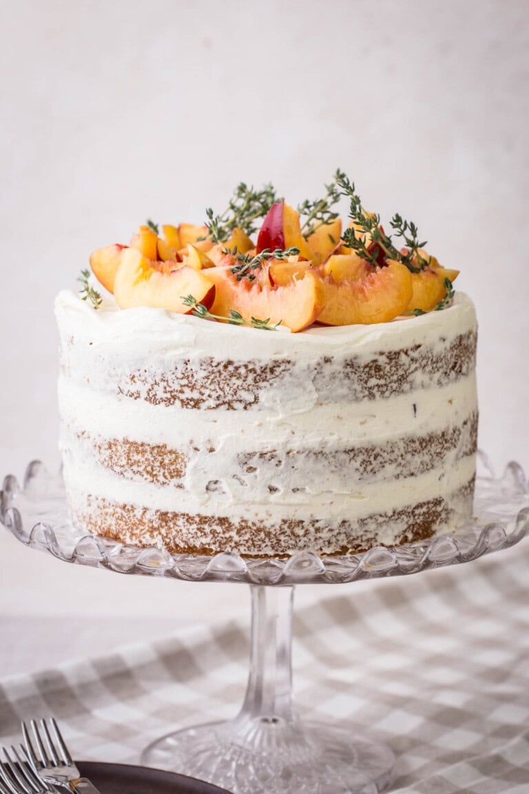 Nectarine Thyme Limoncello Cake on a cake stand.