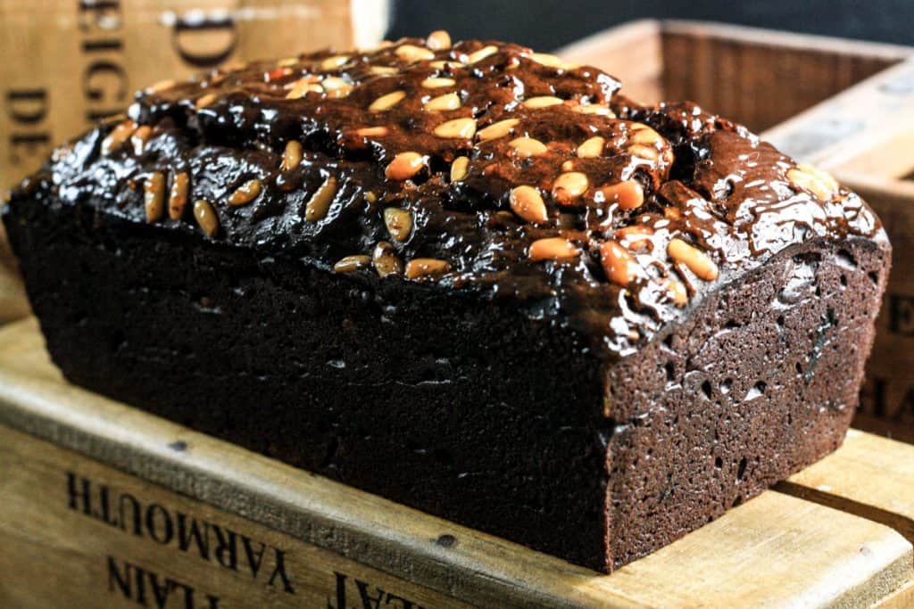 chocolate cake sitting on top of a wooden board