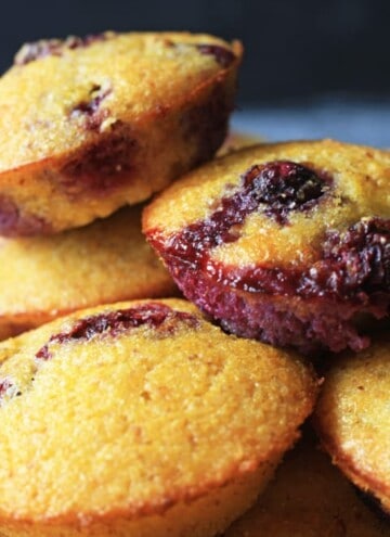 A close up of blueberry cornbread muffins