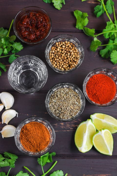 bowls of ingredients for fajita paste on a table