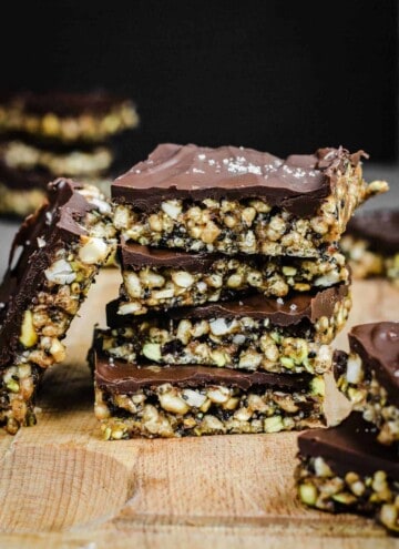 Side view of stack of No-Bake Chocolate Salted Energy Bars on a wooden board