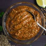 A bowl of fajita paste with spoon