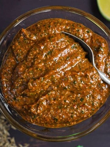 A bowl of fajita paste with spoon