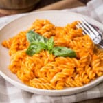Pasta with roasted tomato sauce in a bowl.