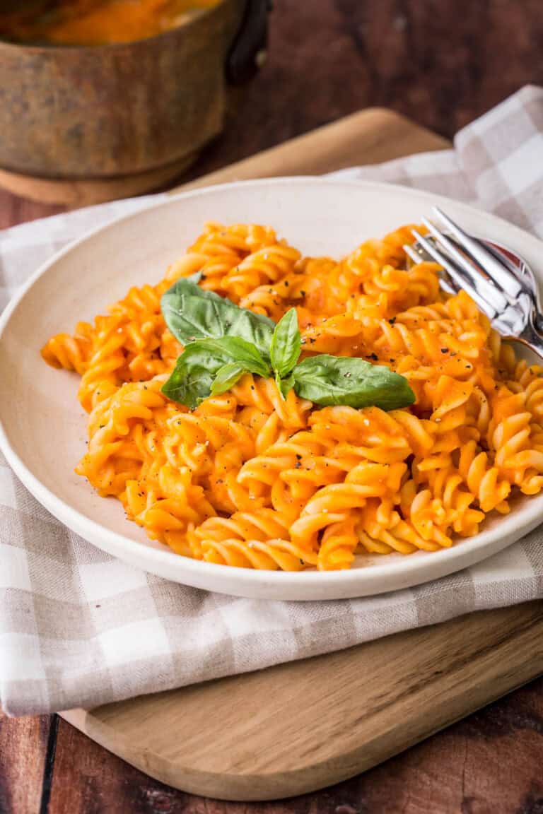 Pasta with roasted tomato sauce in a bowl.