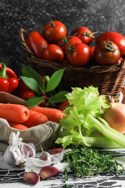 A bunch of ingredients for tomato sauce on a table