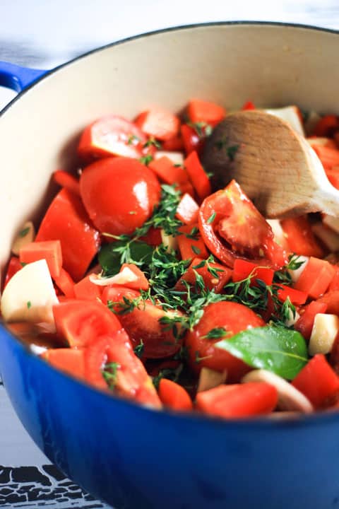 ingredients for tomato sauce cooking in a pan