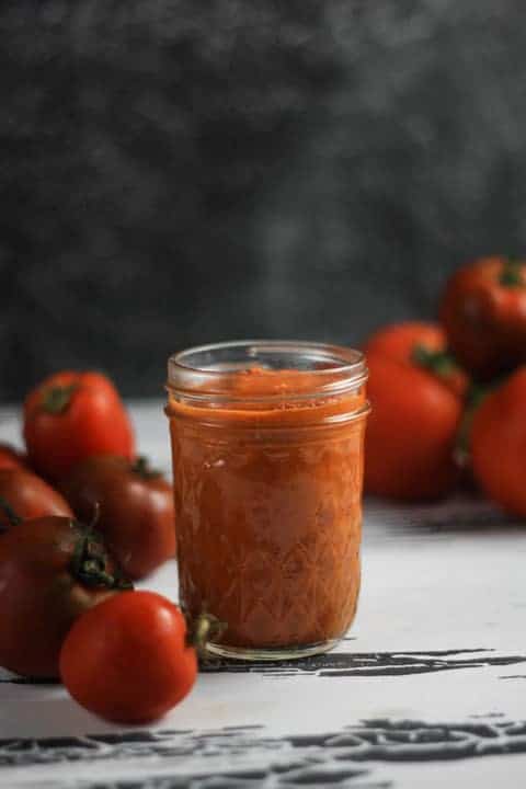 A close up of a jar of tomato sauce