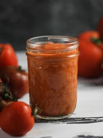 A close up of a jar of tomato sauce