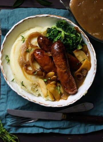 Warm and comforting roasted sausages on a mound of brown buttered mashed potato, thickly ladelled with apple cider onion gravy and adorned with sweetly salted caramelised cinnamon granny smiths