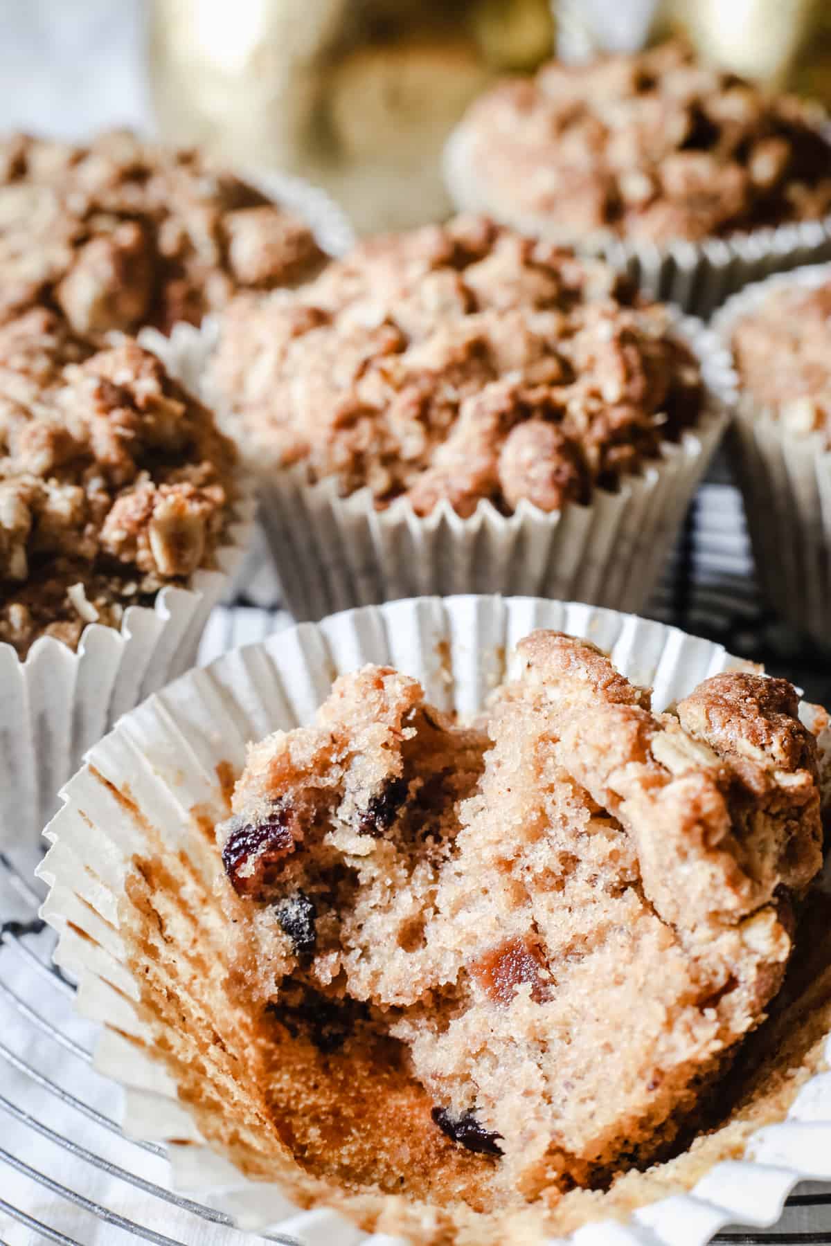 Halved mincemeat muffin on a wire rack