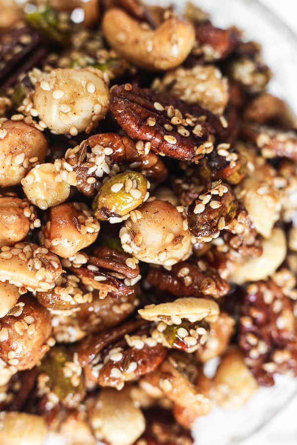 A close up of nuts in glass dish on table