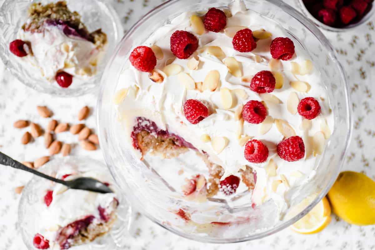 A large bowl of trifle from above with a huge scoop taken out