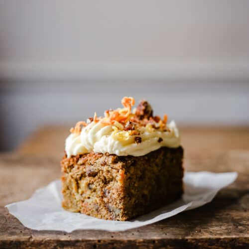 A piece of cake sitting on top of a wooden table