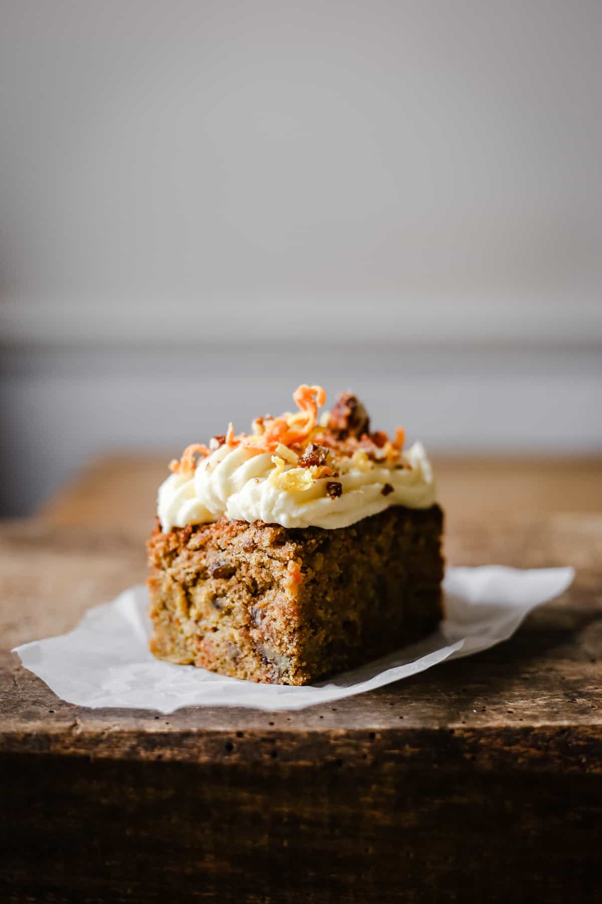 A piece of cake sitting on top of a wooden table