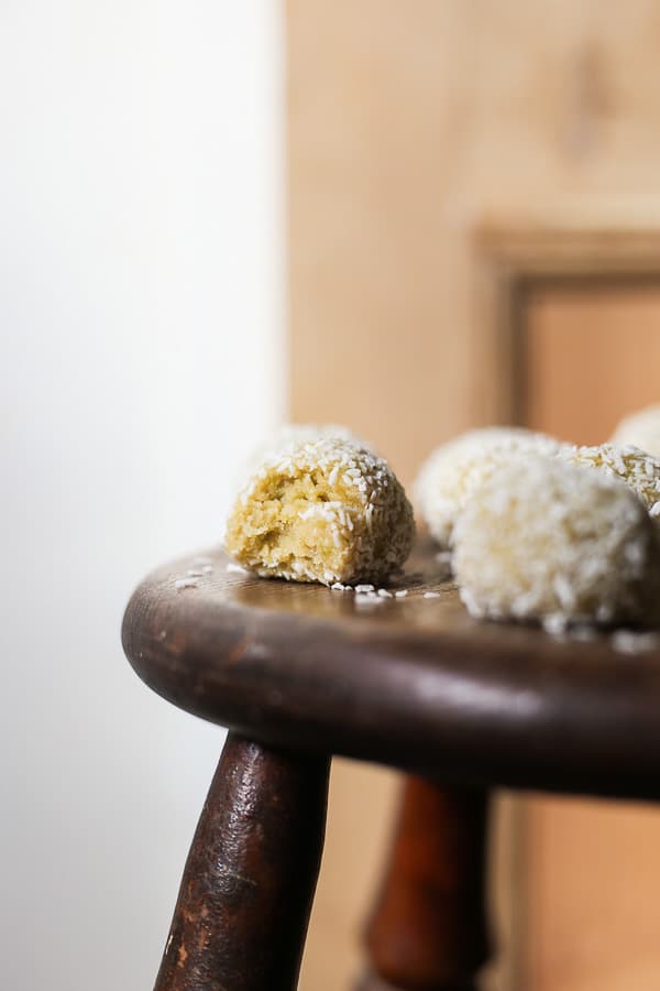 coconut lime energy balls on a wooden table