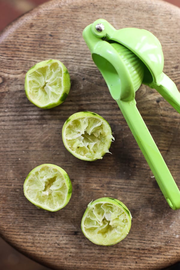 A close up of limes on a table