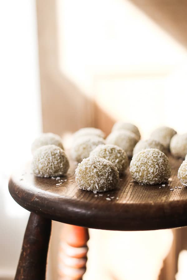 coconut lime energy balls on wooden stool