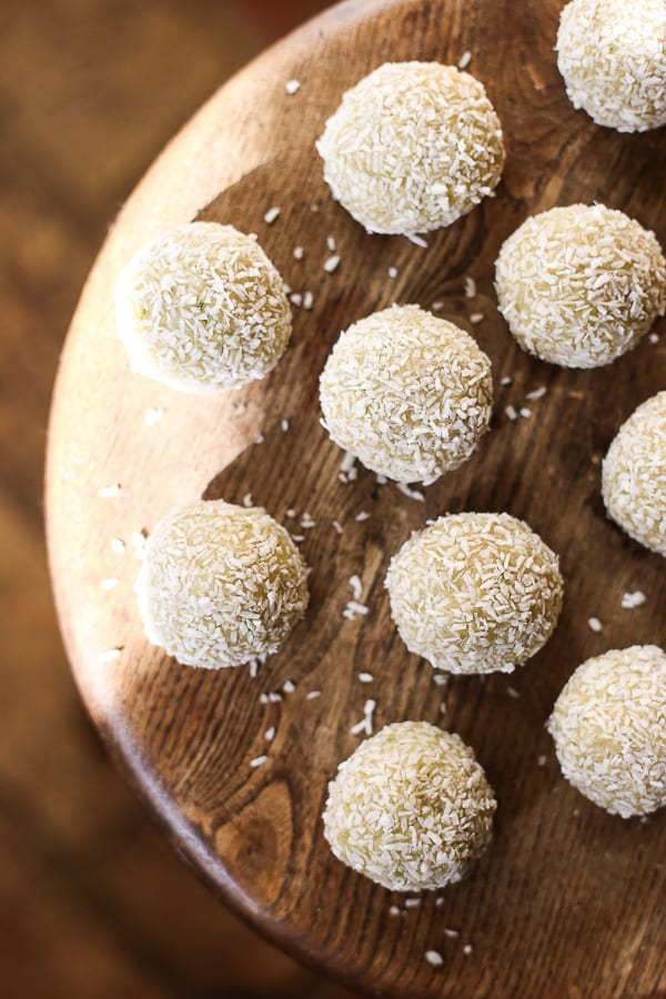 coconut lime energy balls on a wooden table