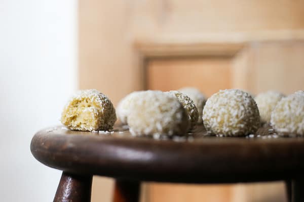 coconut lime energy balls on a wooden table