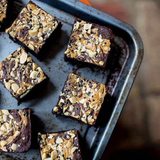 Black Sesame Peanut Butter Brownies {gluten-free} Gluten-free Black Sesame Peanut Butter Brownies are packed with honeyed black sesame, swirled generously with peanut butter layered through the brownie and topped with salted peanuts and black sesame.