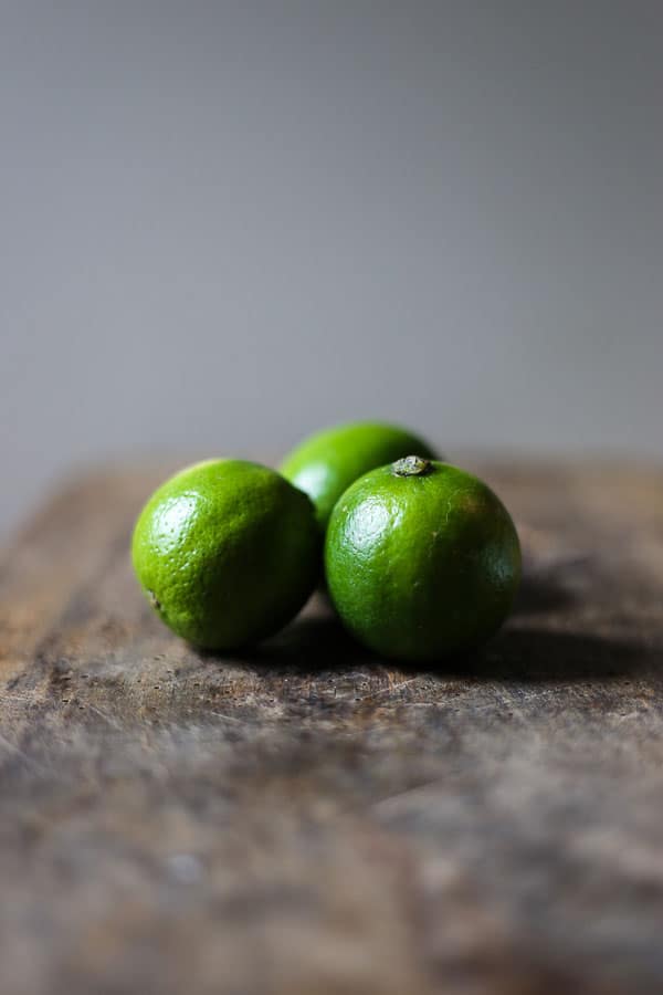 limes on wooden table