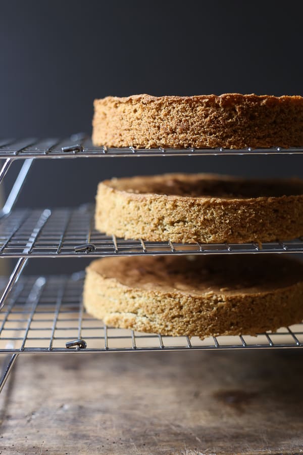 Three cakes on wire racks