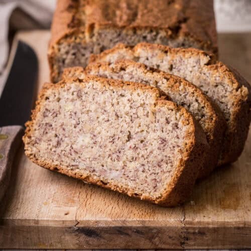 Gluten-Free Banana Bread sliced on a wooden board