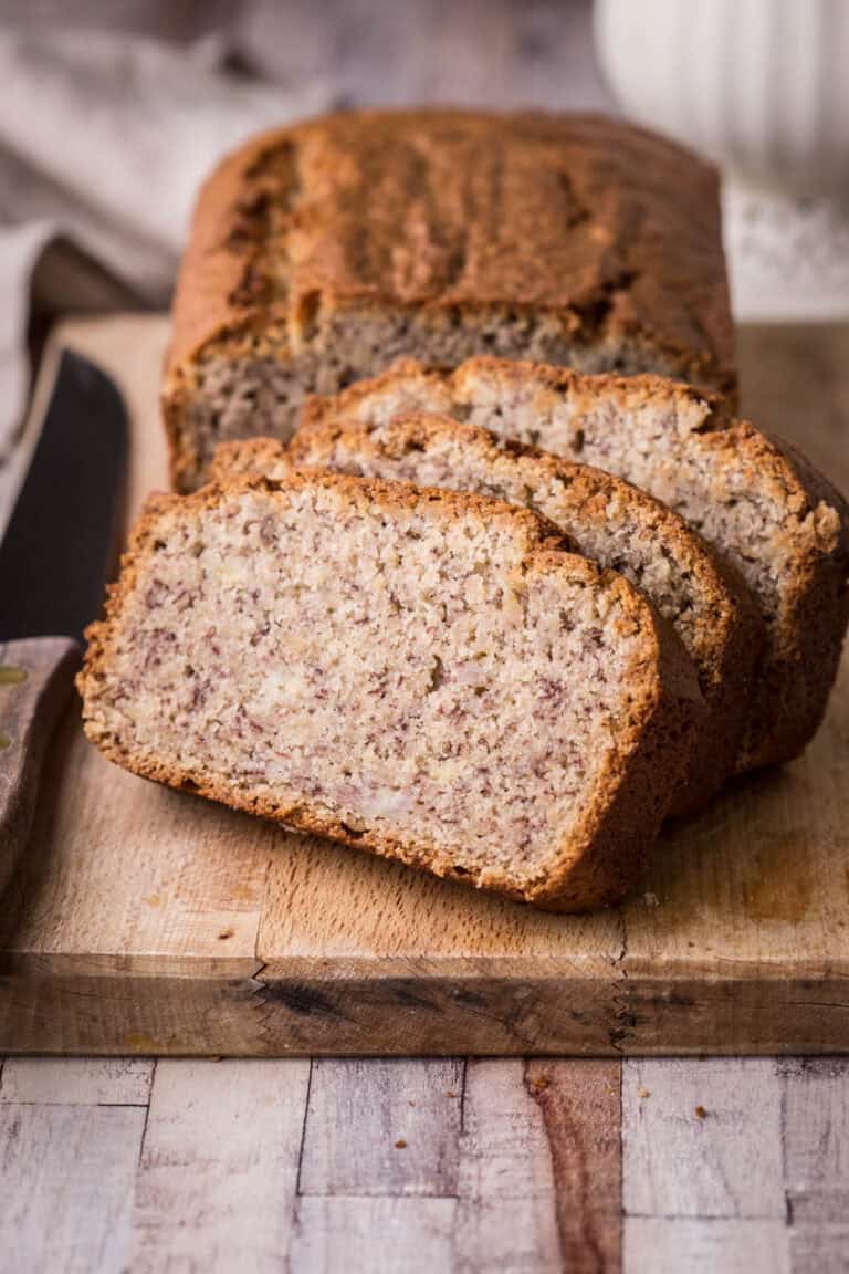 Gluten-Free Banana Bread sliced on a wooden board