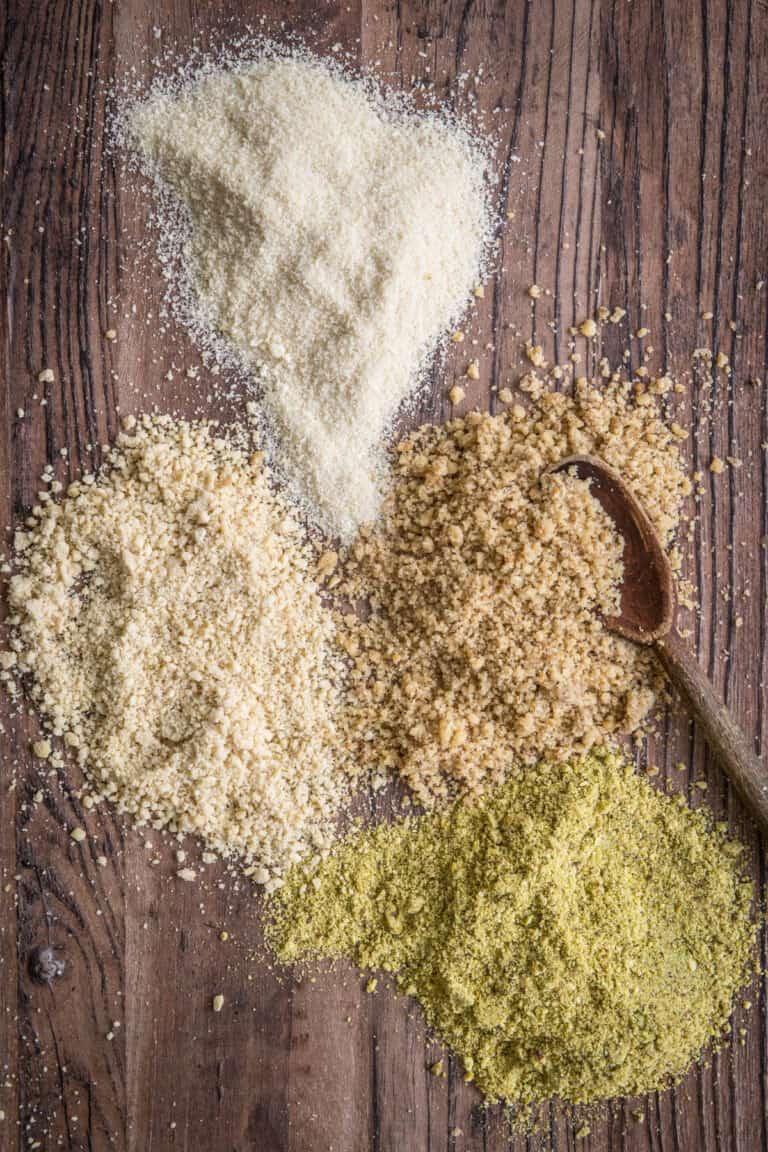 overhead shot of nut flours on a wooden board