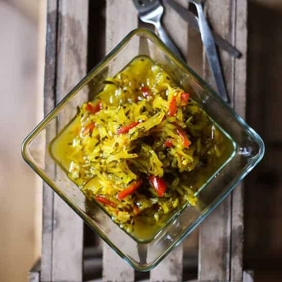 Courgette Relish on a wooden box with forks