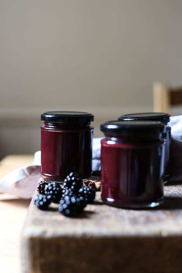 jars of hoisin sauce on wooden board