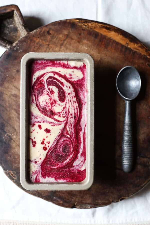 Blackberry Ripple Ice Cream in tin on wooden board