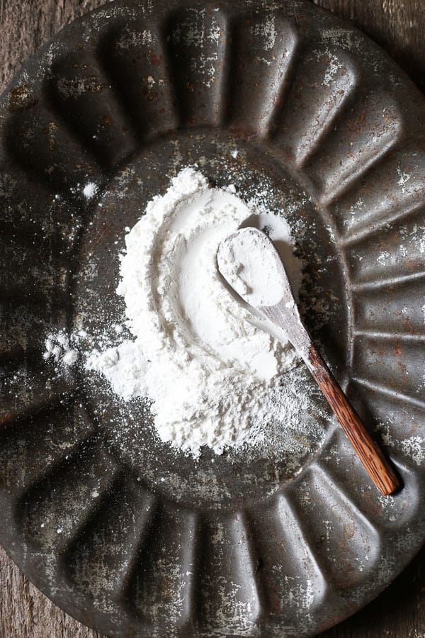 Sweet Rice Flour on a metal plate with a wooden spoon