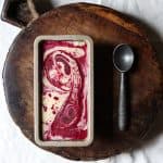 Blackberry Ripple Ice Cream in tin on wooden board