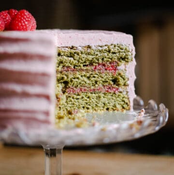 cake on cake stand on wooden table