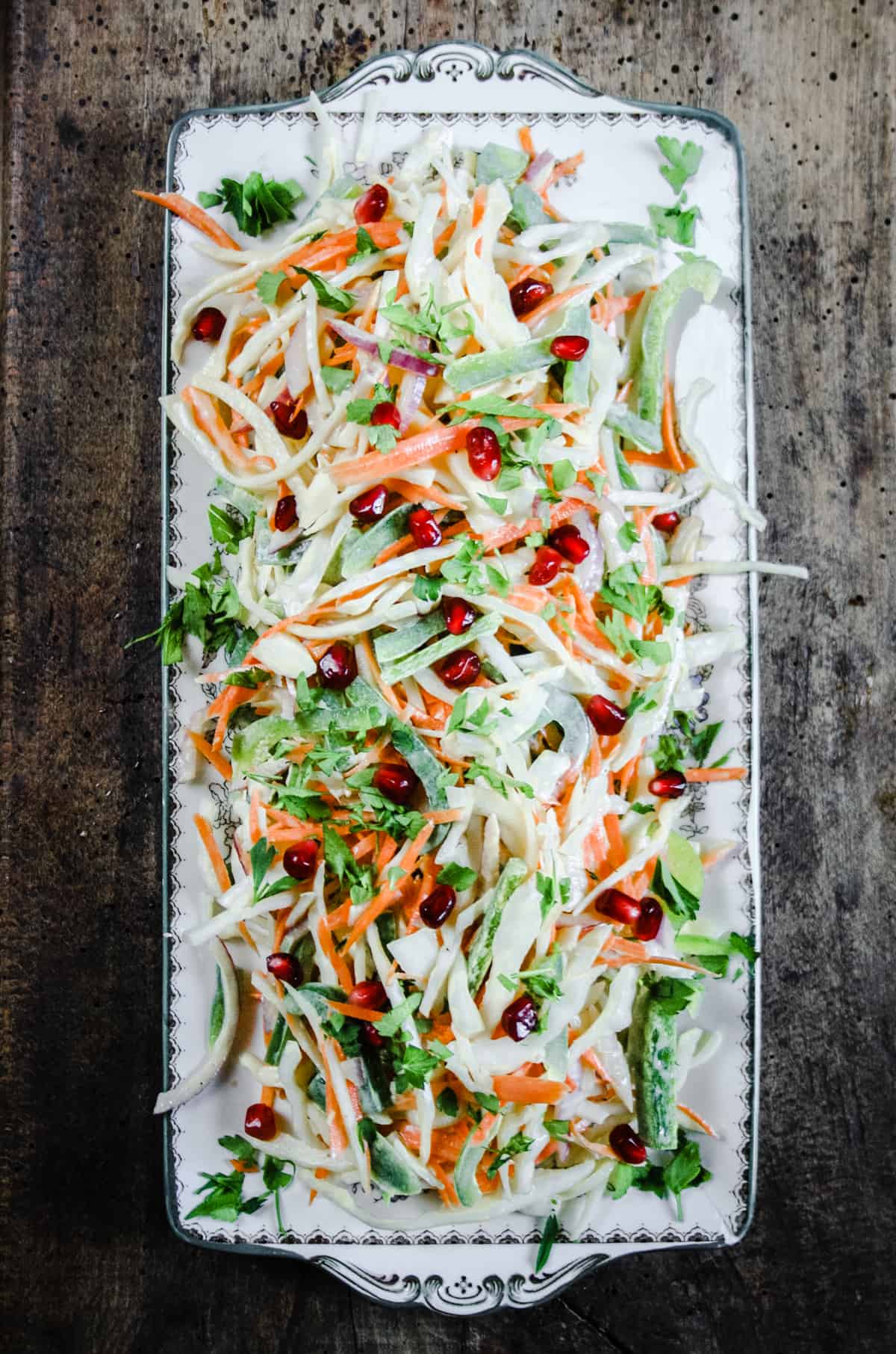 Coleslaw heaped on a plate on a table