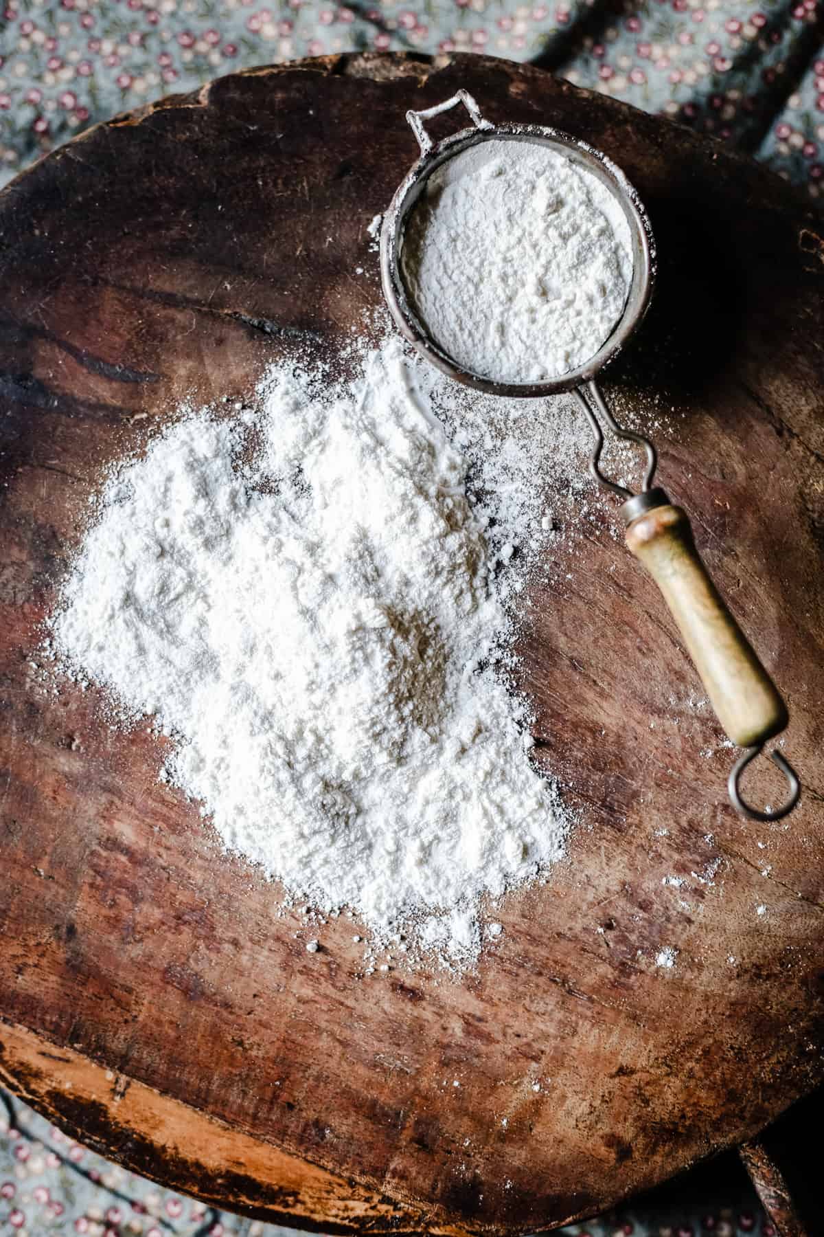 White rice flour on a board with a small sieve