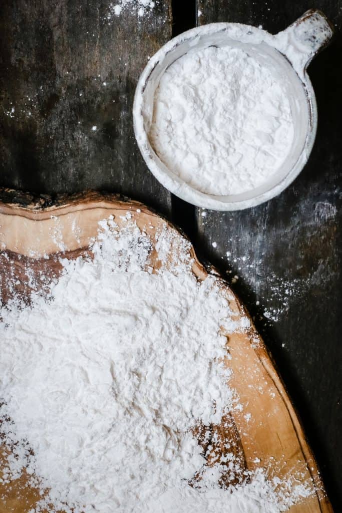 an image showing tapioca flour on a board and in a mug